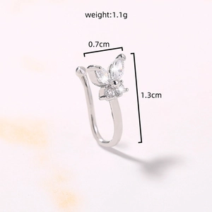Macro shot of silver butterfly stud earring with clear crystals and size measurements