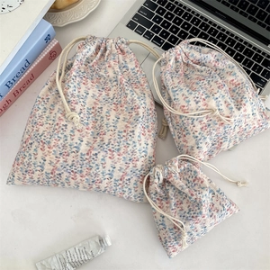 Three-piece floral drawstring storage bags for cosmetics and travel in diverse sizes