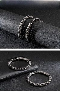 Macro detail of retro stainless steel wheat and Cuban chain bracelets with metal clasp