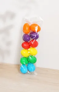 Close-up of colorful decorative plastic eggs in a transparent bag for Easter DIY crafts