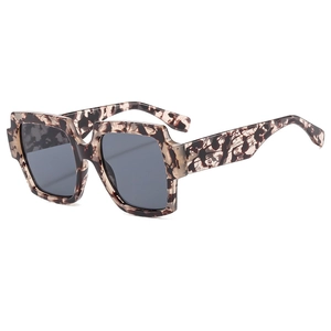 Classic square leopard print sunglasses with dark grey lenses in a 45-degree side view