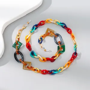 Detail of colorful acrylic eyeglass chain with geometric links and lobster clasp