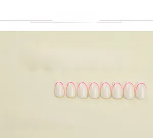 Detail view of 22 pieces milky white press-on nails with pink arc tips in various sizes