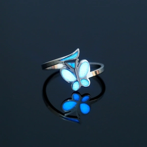 Detailed close-up of a 304 stainless steel glowing butterfly ring with blue luminous wings