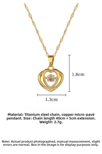 Detail of gold heart pendant with dancing stone and shimmering micro-set zirconia stones