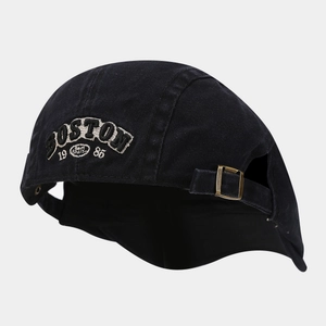 Detail of vintage black cotton cap with Boston 1986 embroidery and metal buckle