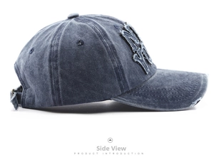 Detail view of washed cotton baseball cap with vintage frayed NY patch and metal buckle