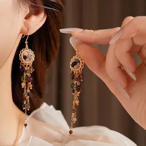 Vintage flower tassel earrings with colorful beads and golden hollow floral design