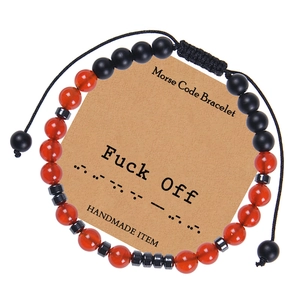 Detail of handmade Morse code bracelet with red agate beads and adjustable braided cord