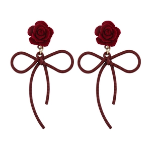 Elegant red flocked rose earrings with long bowknot pendants on a clean white background