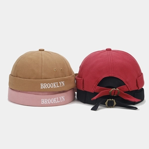 Detail of adjustable metal buckle and Brooklyn embroidery on vintage cotton docker hats