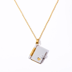 Gold chain with silver openable book locket pendant featuring heart cutout design