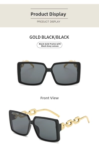 Detail view of square sunglasses featuring golden metal chain temples and dark grey lenses