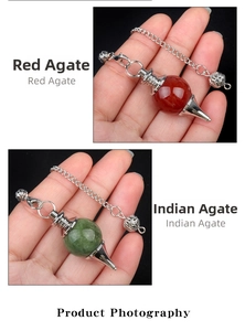 Detail of Red Agate and Indian Agate dowsing pendulums with silver cone metal holders