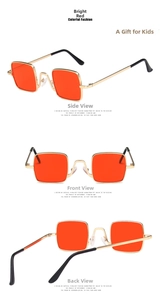 Close-up of vintage square metal frame sunglasses for kids with vibrant red lenses