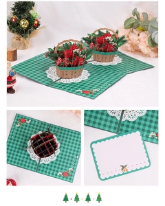 Detailed 3D pop-up Christmas card featuring a poinsettia flower basket and message card