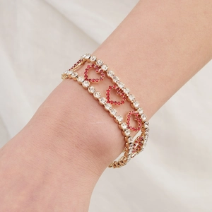 Luxury heart-shaped gold bracelet with sparkling red and white rhinestones for women