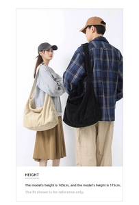 Detailed comparison of beige and black corduroy crossbody bags with adjustable straps