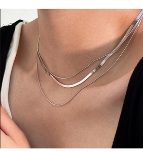 Detailed view of Italian S925 sterling silver triple-layer snake bone chain necklace