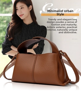 Detailed close-up of brown litchi pattern leather handbag showing fine texture and strap