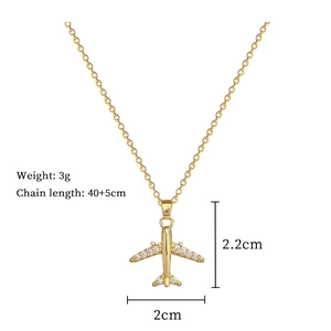 Detail showing 3g gold airplane pendant with crystals and 40+5cm chain size
