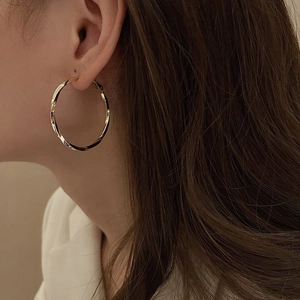 Chic twisted gold hoop earrings for women with high-quality metallic finish and texture