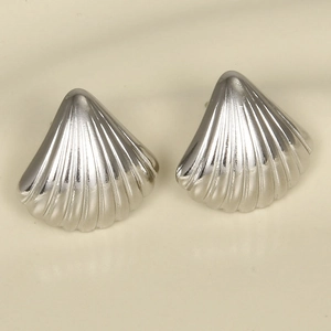 Macro detail of silver stainless steel seashell stud earrings with textured finish