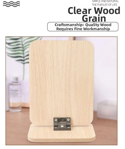 Detail of natural wood grain and metal hinge on foldable desktop makeup mirror stand