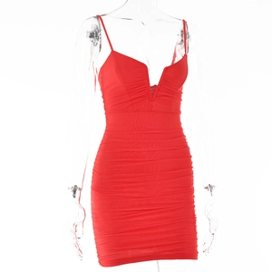 Close-up of red sleeveless mini dress featuring deep V-neck and ruched fabric texture