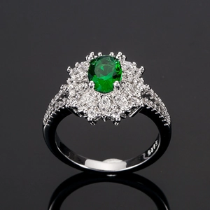 Exquisite S925 silver flower ring featuring a large green emerald zircon with halo stones