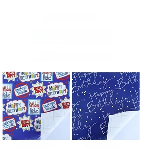 Detail of birthday wrapping paper with grid lines and colorful cartoon typography
