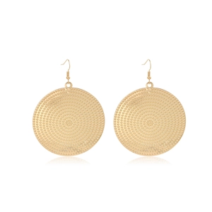 Detail of vintage gold textured disc drop earrings with granular metallic finish