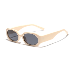 Vintage oval cream white sunglasses with dark grey lenses in a 45-degree angle studio view