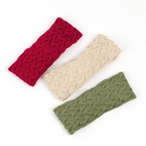 Detailed cable knit texture of winter thermal headbands in red, beige and dark green colors