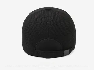 Detail view of the black baseball cap back with waffle texture and adjustable buckle