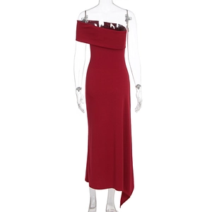 Close-up of the asymmetric deep red off-shoulder neckline and tailored waist of the dress