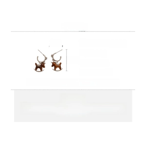 Macro detail of horse earrings with dimensions showing copper, zircon and resin texture