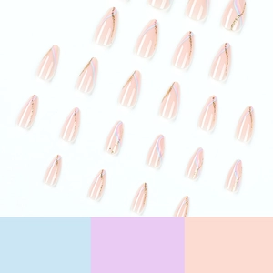 Almond press-on nails with nude base, blue pink swirl patterns and gold glitter accents
