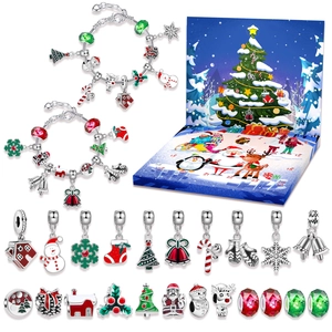 Detailed Christmas advent calendar jewelry set with 24 festive charms and two bracelets