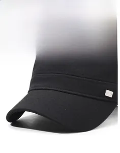 Detail of black flat top cap with canvas texture and silver metal OK SD logo plaque