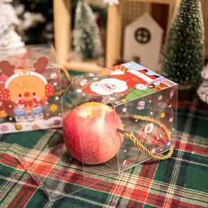 Transparent Christmas apple gift box with Santa motif and gold handle for holiday favors