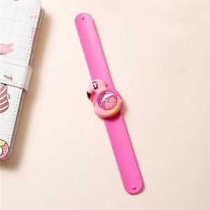 Detailed view of kids flamingo snap watch with pink silicone strap and analog dial
