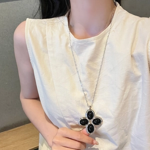 French vintage silver necklace featuring a large black four-leaf clover gem pendant