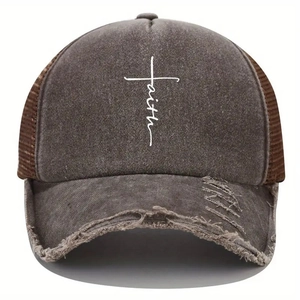 Close-up detail of vintage washed baseball cap with faith print and distressed brim