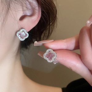 Elegant silver studs featuring pink clover flowers with sparkling crystals for women