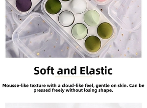 Detailed view of soft teardrop makeup sponges in a storage box on purple fabric