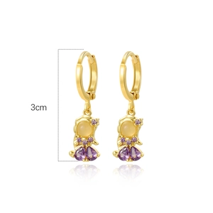 Detailed view of gold animal earrings with yellow and purple zircons measuring 3cm