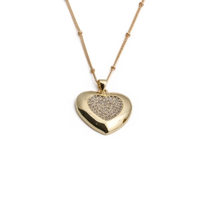 Gold heart pendant necklace with shimmering cubic zirconia on a satellite chain