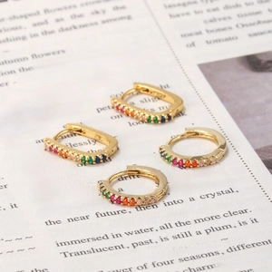 Chic gold-plated earrings set featuring colorful cubic zirconia on open English book