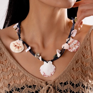 Handmade raffia woven seashell necklace with white scallop pendant for summer beach vacations